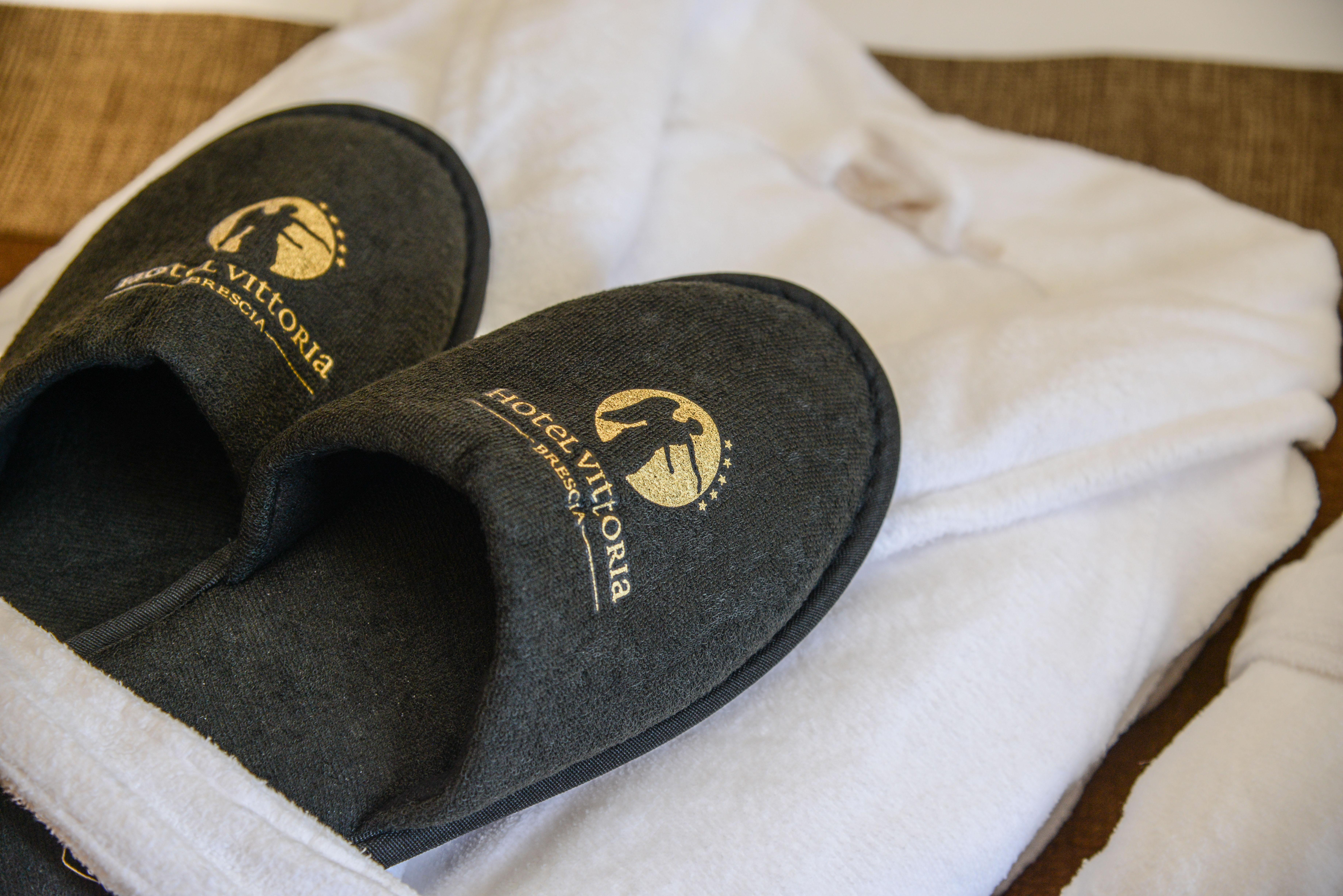 Hotel Vittoria Brescia Exteriör bild Slippers and bathrobe